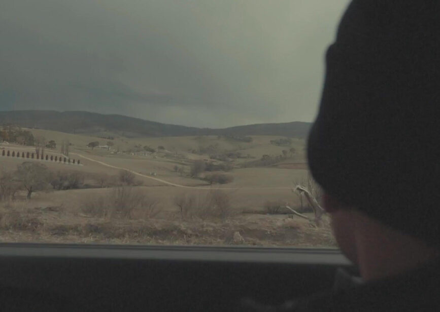 Landscape framed by a car window